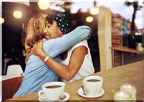 Friends hugging and coffee