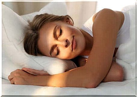 Woman asleep with the sun on her face.