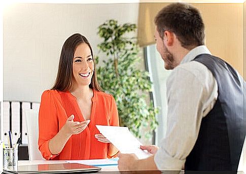 Woman explaining to a boy how to improve the curriculum vitae