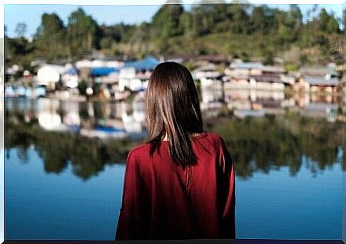 Woman looking at a village.