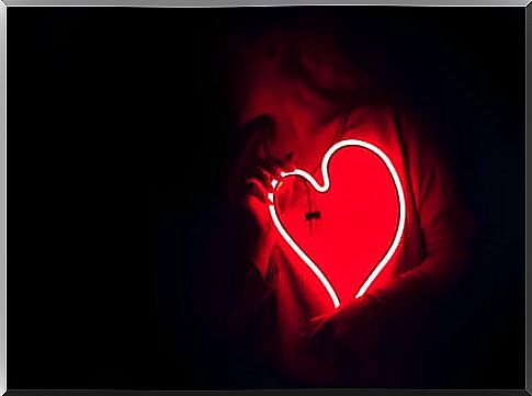 Woman with heart shaped neon