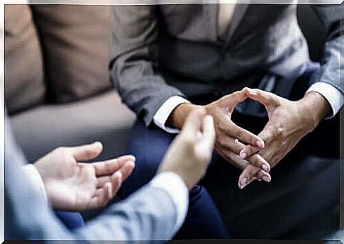 Businessmen with folded hands.