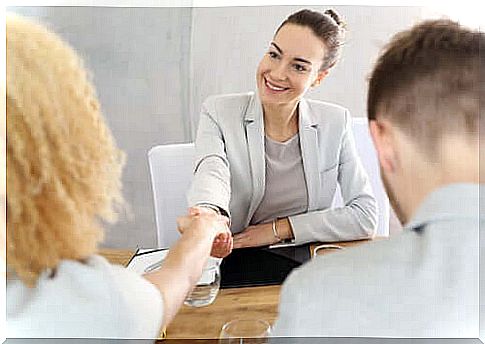 Women shaking hands to sign a pact.