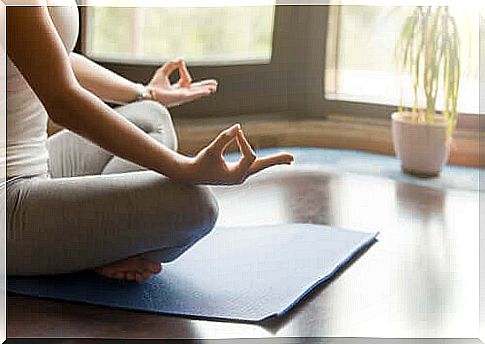 Woman meditating on the mat