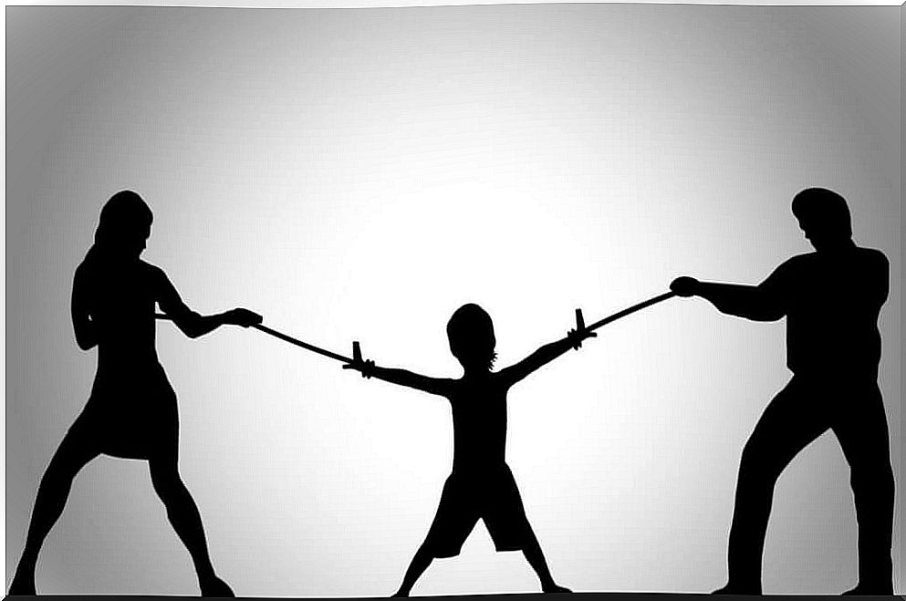 Parents pulling their son's arms with a rope