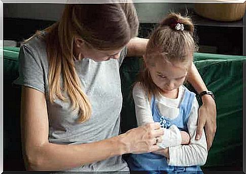 Mother consoling her daughter.