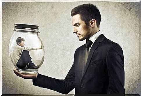 Man inside a glass ball supported by another man