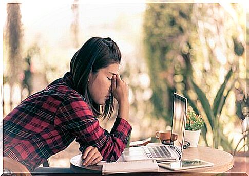 Depressed girl in front of the computer