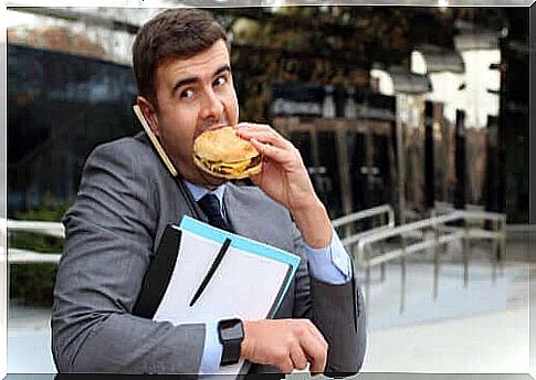 Man eating a sandwich on the fly